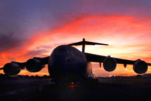 A C-17 Globemaster III sits on the flightline at Hickam Air Force Base, Hawaii Sept. 3, 2009, as crews prepare to deliver humanitarian supplies to the Samoa region, which was devastated by a tsunami. A contingent from Hawaii, including Hawaii National Guard and Hawaii Air National Guard, took off for American Samoa with relief supplies and equipment to assist in the region. (U.S. Air Force photo/Staff Sgt. Mike Meares)