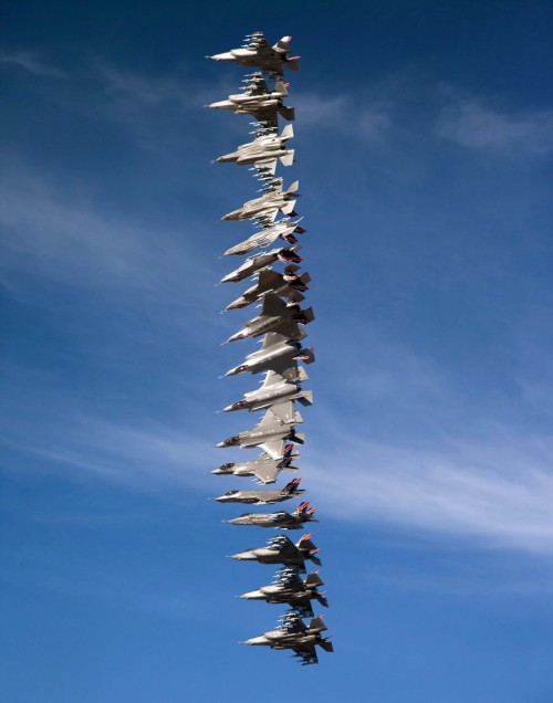 Lt. Col. Brent Reinhardt completes a 360-degree roll in F-35A AF-1 with a full weapon load during a test flight from Edwards AFB, California, on 10 January 2014. The photo is a composite of seventeen images taken during the 360-degree roll. (Photo by Matthew Short)